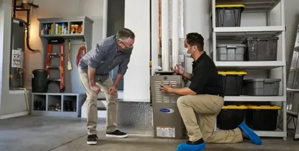 P-Aire HVAC employee explaining the issue to a customer