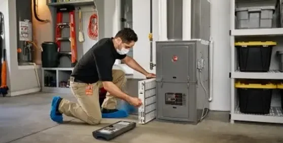 P-Aire Heating & AC Employee fixing an hvac system